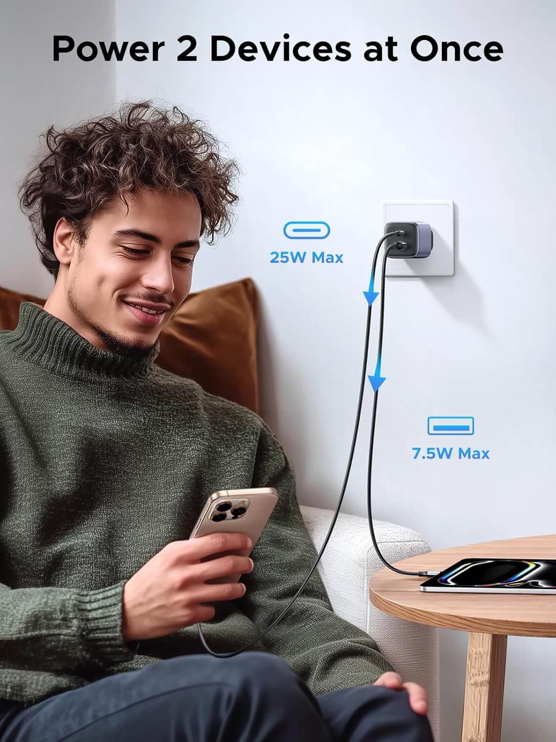 Man charging two devices simultaneously with UGREEN 35W USB C Charger, showcasing 25W and 7.5W outputs.
